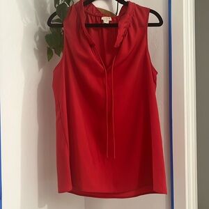 Sleeveless ruffle tie neck top